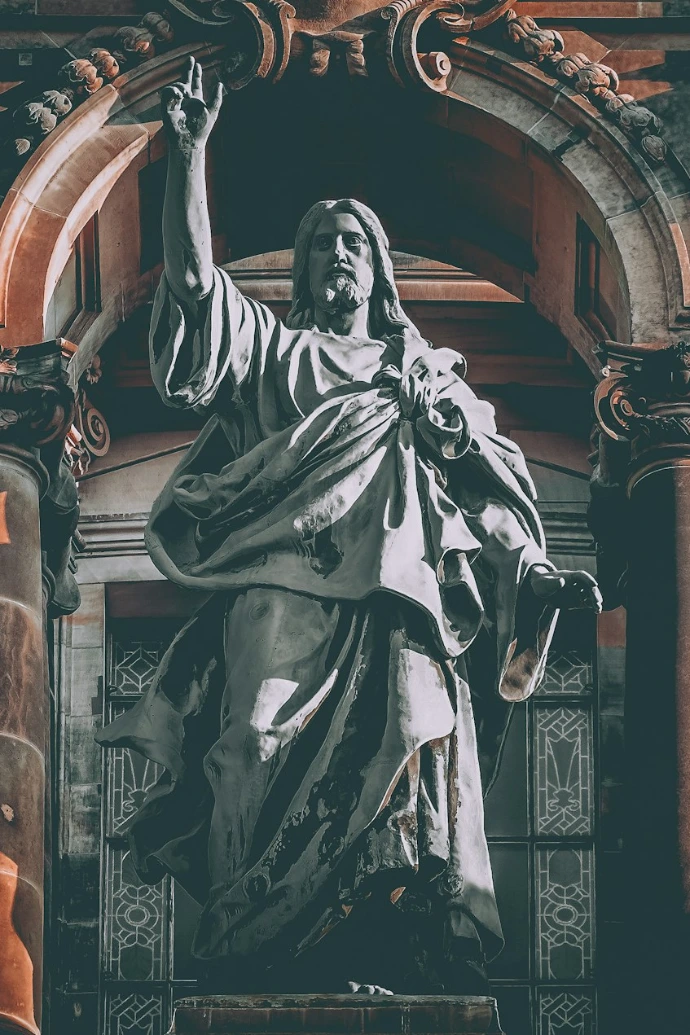 man in robe statue in cathedral